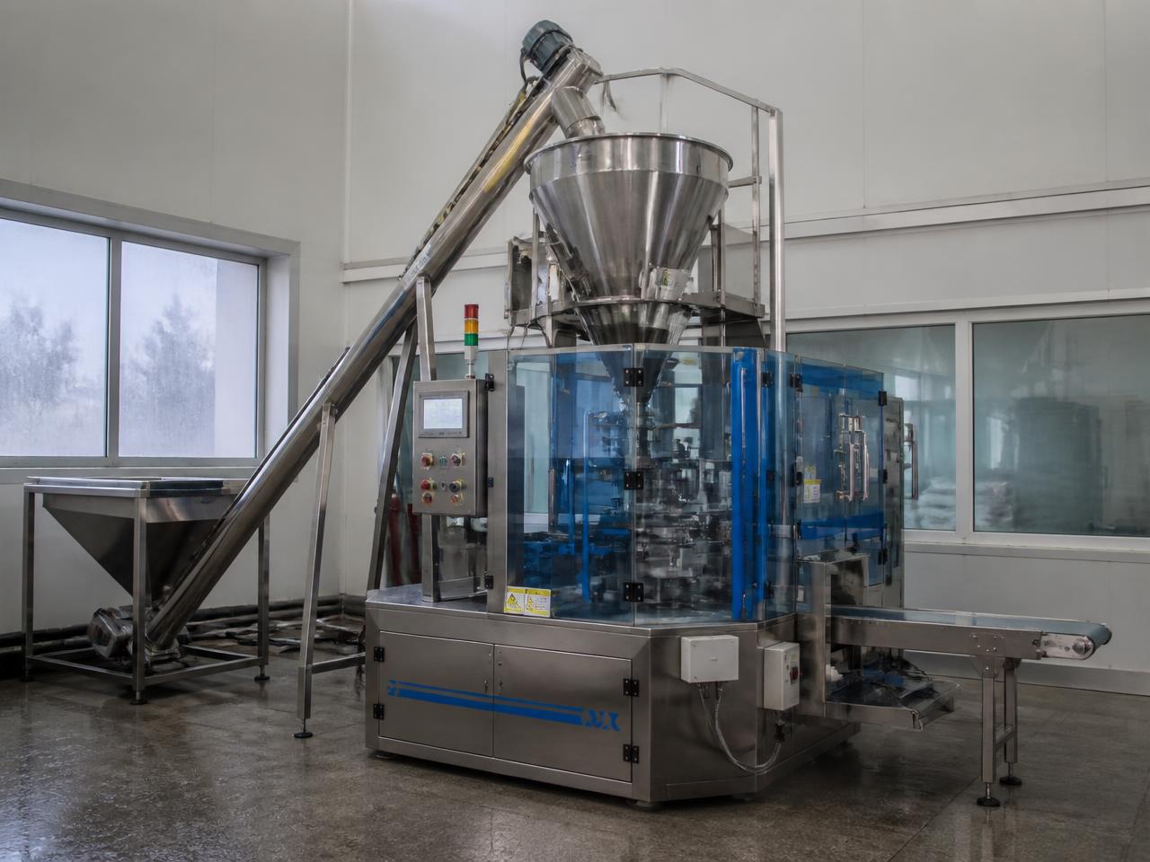 Automatic rotary pouch packaging machine with auger filler